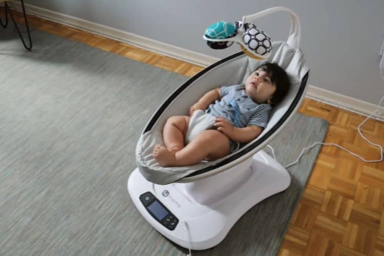 What are the risks of letting a baby sleep in a Mamaroo swing?